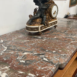 Antique late 19th century Transitional style marble top cabinet featuring beautiful marquetry inlay and decorative mounts. In good original detailed condition. 