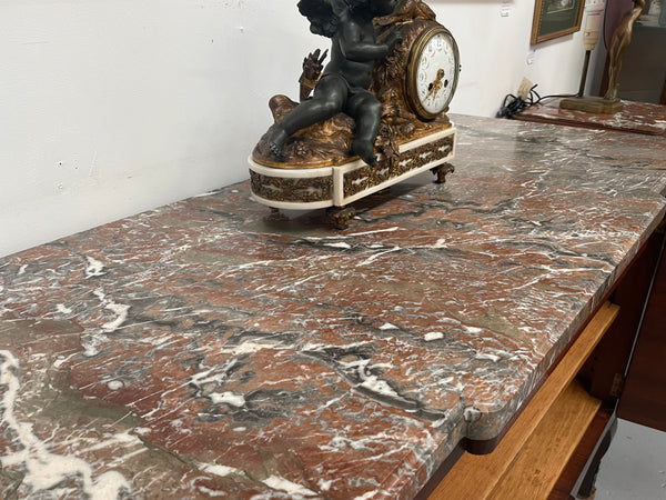 Antique late 19th century Transitional style marble top cabinet featuring beautiful marquetry inlay and decorative mounts. In good original detailed condition. 