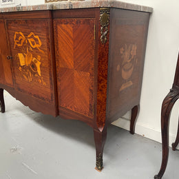 Antique late 19th century Transitional style marble top cabinet featuring beautiful marquetry inlay and decorative mounts. In good original detailed condition. 