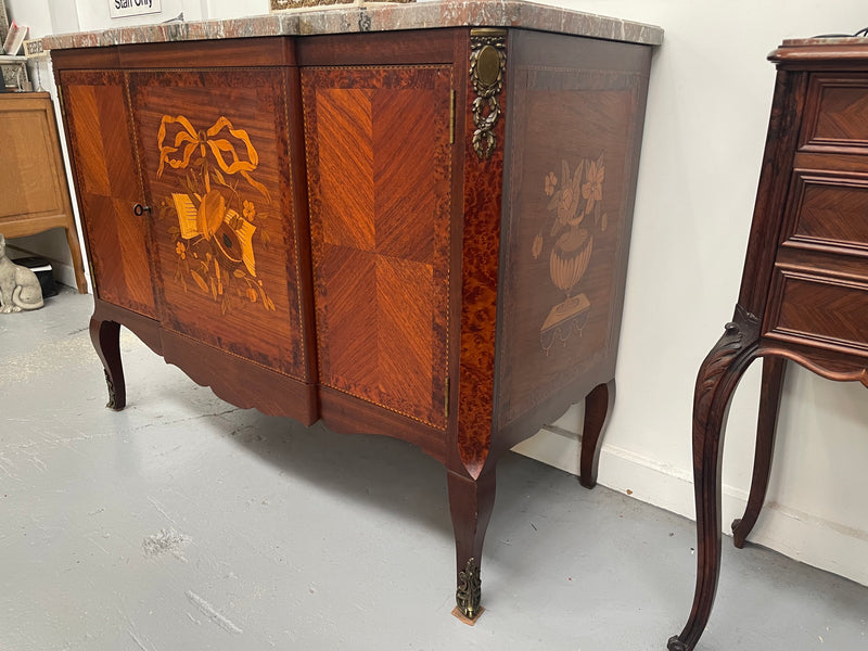 Antique late 19th century Transitional style marble top cabinet featuring beautiful marquetry inlay and decorative mounts. In good original detailed condition. 