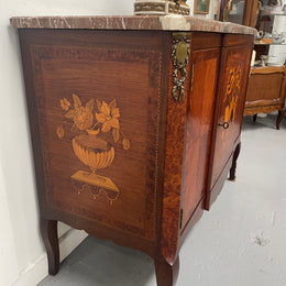 Antique late 19th century Transitional style marble top cabinet featuring beautiful marquetry inlay and decorative mounts. In good original detailed condition. 