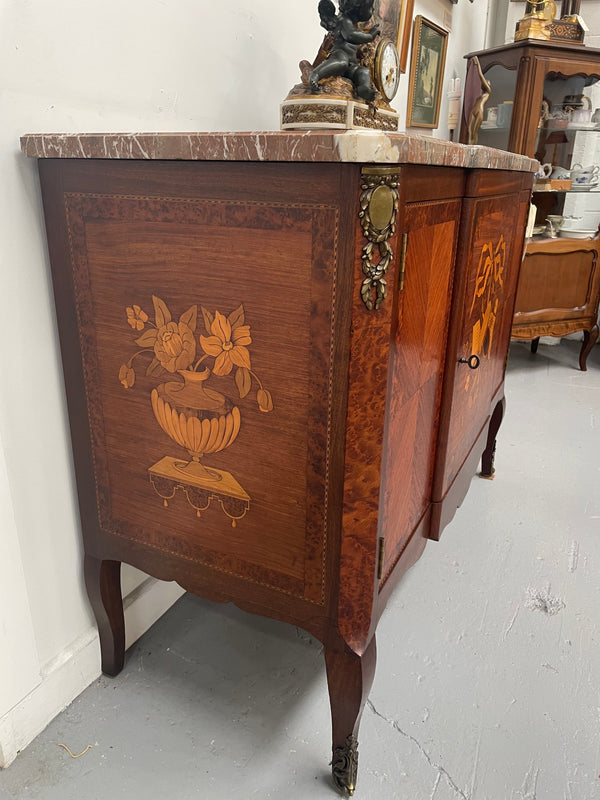 Antique late 19th century Transitional style marble top cabinet featuring beautiful marquetry inlay and decorative mounts. In good original detailed condition. 