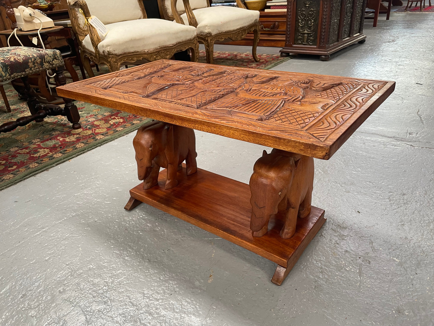 Vintage Hand Carved Teak Coffee Table Featuring Elephants