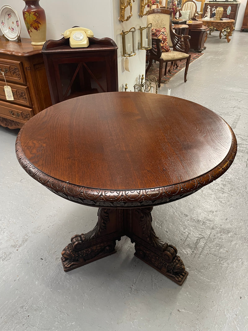 Antique French Oak renaissance style round centre table. Featuring amazing detailed carving to base and throughout. Sourced from France and in good original detailed condition.