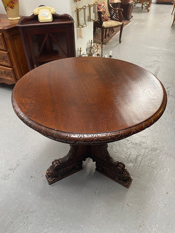 Antique French Oak renaissance style round centre table. Featuring amazing detailed carving to base and throughout. Sourced from France and in good original detailed condition.