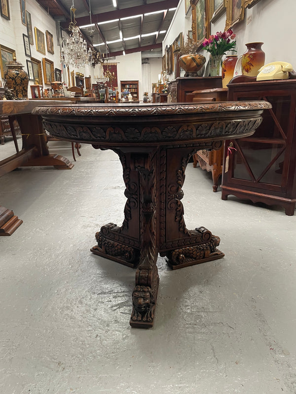 Antique French Oak renaissance style round centre table. Featuring amazing detailed carving to base and throughout. Sourced from France and in good original detailed condition.