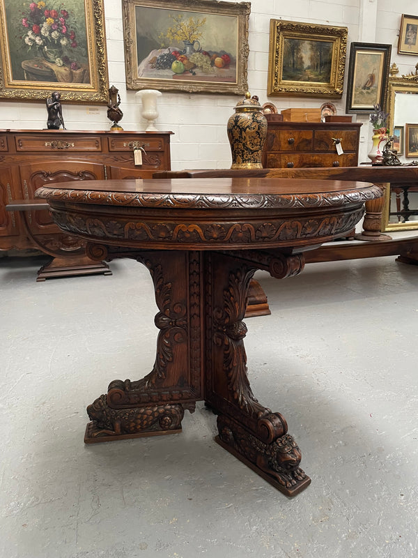 Antique French Oak renaissance style round centre table. Featuring amazing detailed carving to base and throughout. Sourced from France and in good original detailed condition.