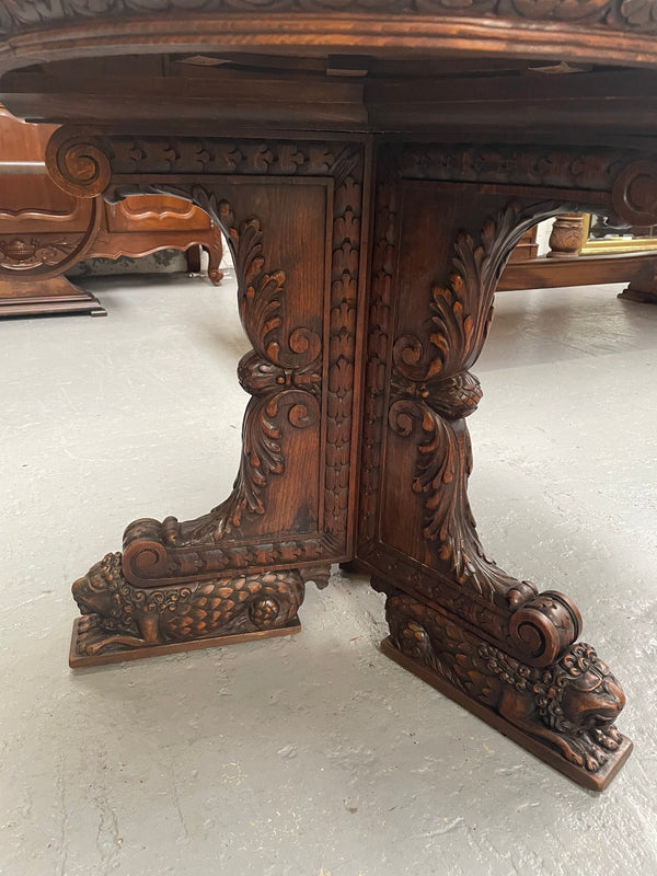 Antique French Oak renaissance style round centre table. Featuring amazing detailed carving to base and throughout. Sourced from France and in good original detailed condition.