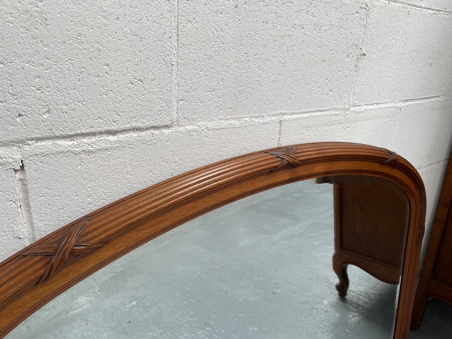 French walnut Art Deco style mantle mirror. Beautiful decorative carvings and still has its original bevelled edge mirror. Sourced directly from France and in good original condition with mirror showing some age. 