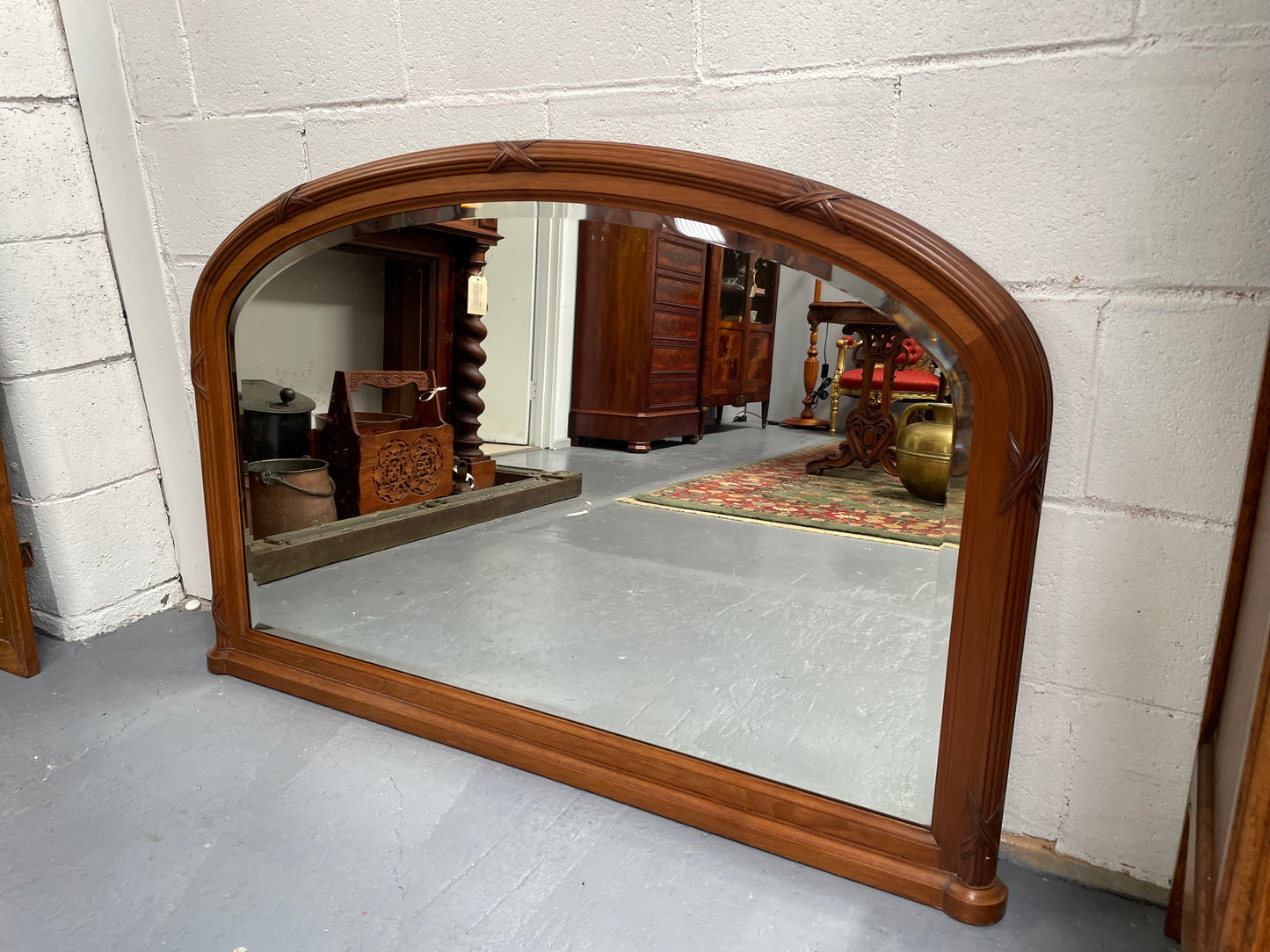 French walnut Art Deco style mantle mirror. Beautiful decorative carvings and still has its original bevelled edge mirror. Sourced directly from France and in good original condition with mirror showing some age. 