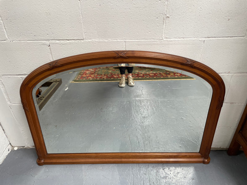 French walnut Art Deco style mantle mirror. Beautiful decorative carvings and still has its original bevelled edge mirror. Sourced directly from France and in good original condition with mirror showing some age. 