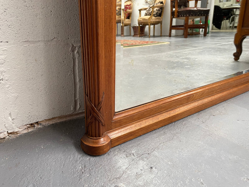 French walnut Art Deco style mantle mirror. Beautiful decorative carvings and still has its original bevelled edge mirror. Sourced directly from France and in good original condition with mirror showing some age. 