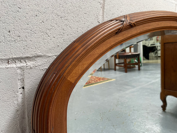 French walnut Art Deco style mantle mirror. Beautiful decorative carvings and still has its original bevelled edge mirror. Sourced directly from France and in good original condition with mirror showing some age. 