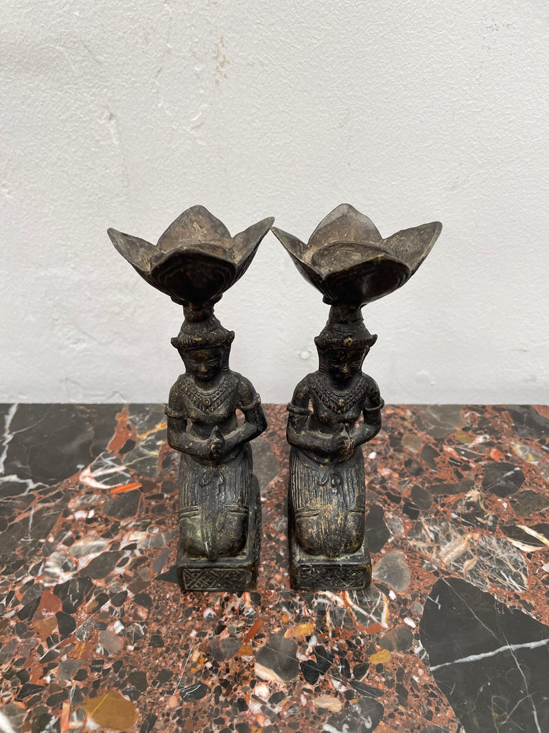 Pair of Thai Antique bronze dark patinated candle holders. They are in good original condition with some signs of age.