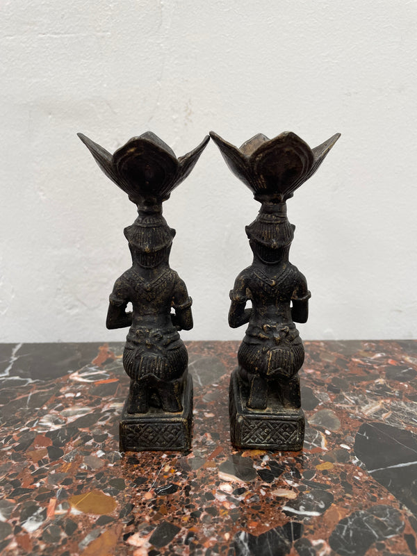 Pair of Thai Antique bronze dark patinated candle holders. They are in good original condition with some signs of age.