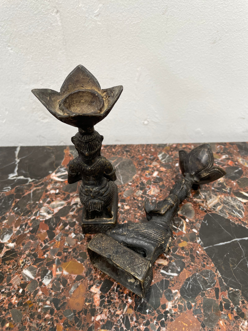 Pair of Thai Antique bronze dark patinated candle holders. They are in good original condition with some signs of age.