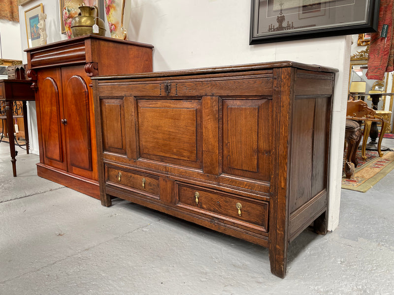 Antique English Georgian oak mule chest. In good condition with good proportions and original colour and patina. Three panel front and two drawers with original tear drop handles. Interior has a small compartment.