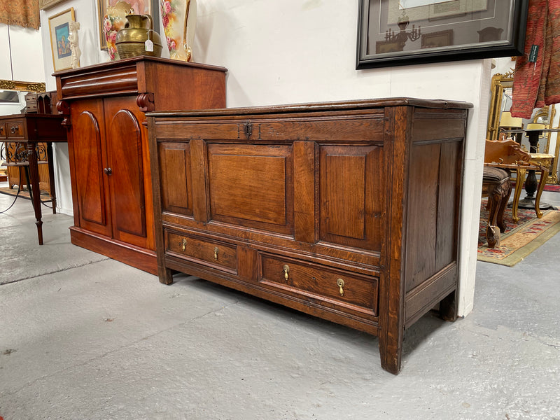 Antique English Georgian oak mule chest. In good condition with good proportions and original colour and patina. Three panel front and two drawers with original tear drop handles. Interior has a small compartment.