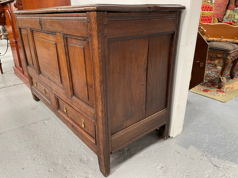 Antique English Georgian oak mule chest. In good condition with good proportions and original colour and patina. Three panel front and two drawers with original tear drop handles. Interior has a small compartment.