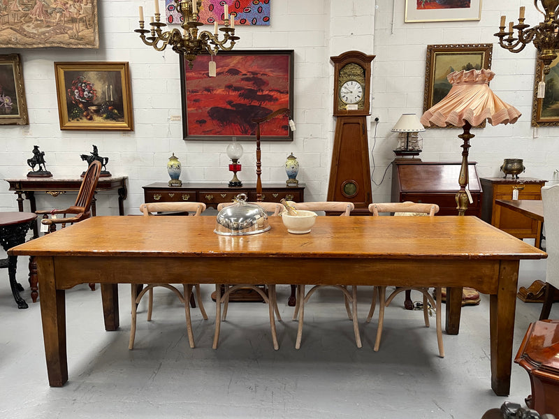 This table stands on four tapered legs supporting the main section. There are four sides with an original long drawer to each end. The top is in good condition commensurate with age and consists of three thick wide planks. The table is very strong and sturdy.