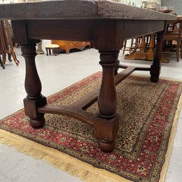 Solid charming rustic French farmhouse table with a stretcher base and turned legs. Imported directly from France and is circa 1930's. In good original detailed condition.