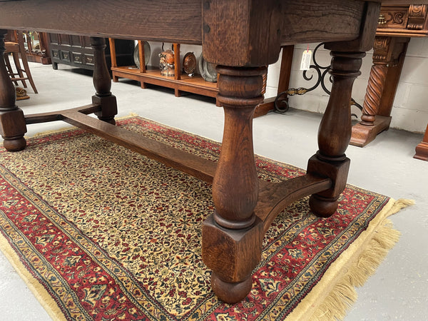 Solid charming rustic French farmhouse table with a stretcher base and turned legs. Imported directly from France and is circa 1930's. In good original detailed condition.