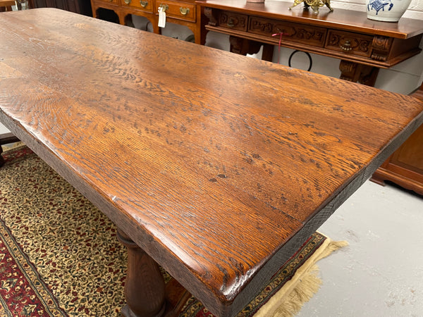 Solid charming rustic French farmhouse table with a stretcher base and turned legs. Imported directly from France and is circa 1930's. In good original detailed condition.