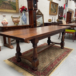 Solid charming rustic French farmhouse table with a stretcher base and turned legs. Imported directly from France and is circa 1930's. In good original detailed condition.