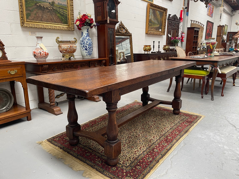 Solid charming rustic French farmhouse table with a stretcher base and turned legs. Imported directly from France and is circa 1930's. In good original detailed condition.