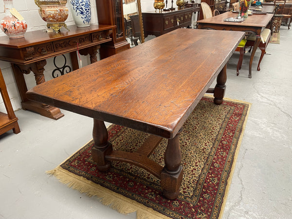 Solid charming rustic French farmhouse table with a stretcher base and turned legs. Imported directly from France and is circa 1930's. In good original detailed condition.