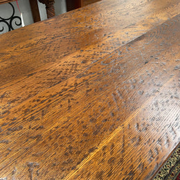 Solid charming rustic French farmhouse table with a stretcher base and turned legs. Imported directly from France and is circa 1930's. In good original detailed condition.