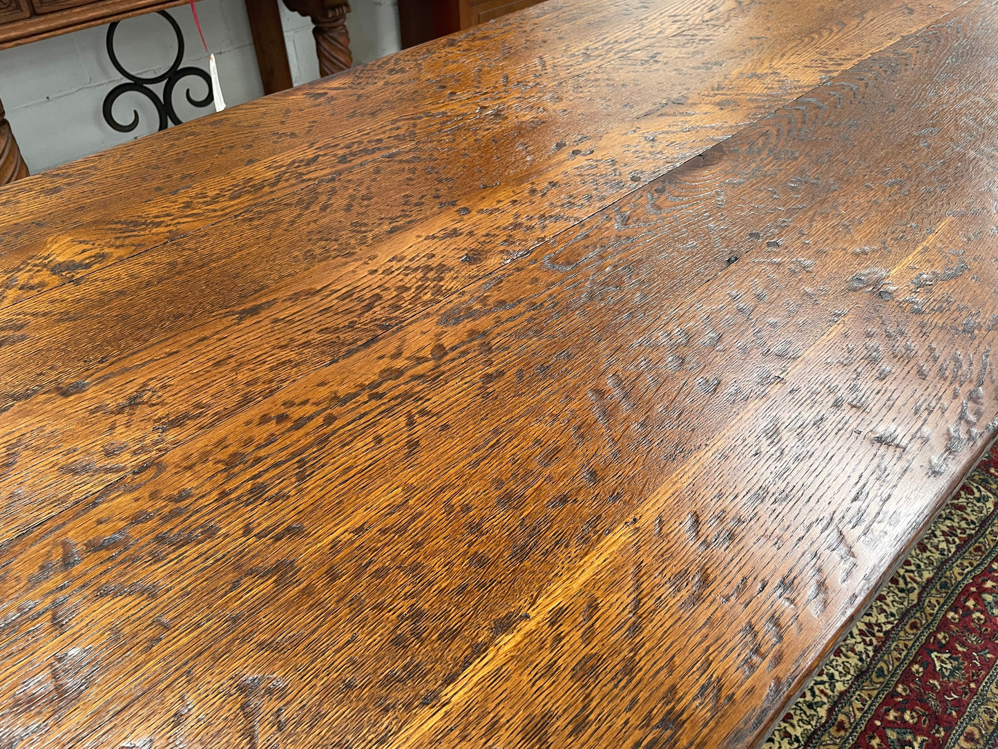 Solid charming rustic French farmhouse table with a stretcher base and turned legs. Imported directly from France and is circa 1930's. In good original detailed condition.