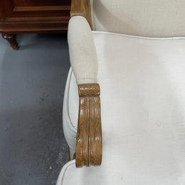 Pair of vintage Louis 15th style oak framed bergeres chairs with good size seats. making them very comfortable to sit in. The upholstery is in used condition with stains as shown in photos. Overall the timber frames are strong &amp; solid. They have been sourced directly from France. 