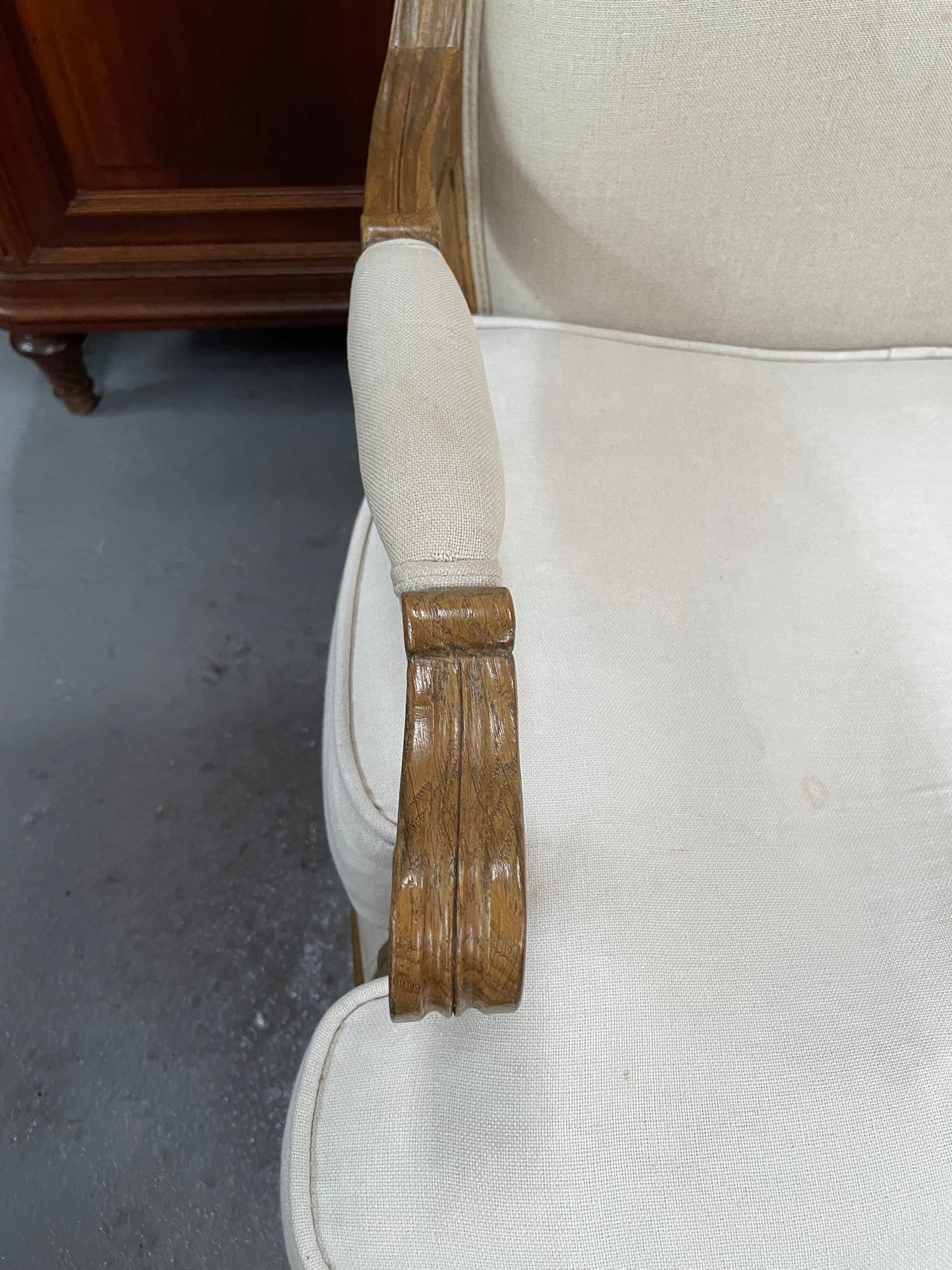 Pair of vintage Louis 15th style oak framed bergeres chairs with good size seats. making them very comfortable to sit in. The upholstery is in used condition with stains as shown in photos. Overall the timber frames are strong &amp; solid. They have been sourced directly from France. 