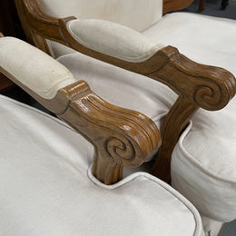 Pair of vintage Louis 15th style oak framed bergeres chairs with good size seats. making them very comfortable to sit in. The upholstery is in used condition with stains as shown in photos. Overall the timber frames are strong &amp; solid. They have been sourced directly from France. 