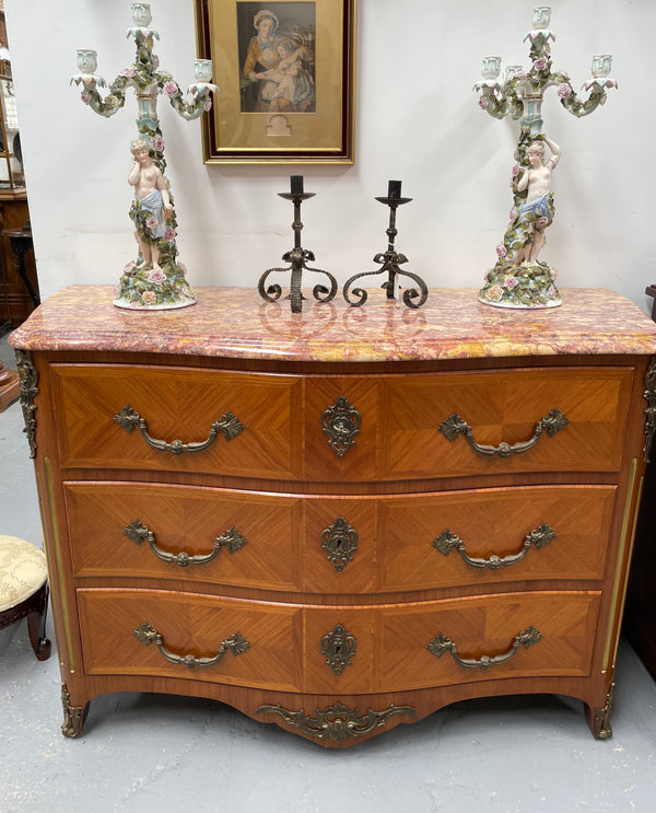 Appealing French Louis XIV style three drawer inlaid marble top commode. It has a stunning marble top and attractive ormolu trims. In good original detailed condition.