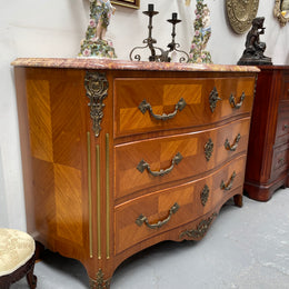 Appealing French Louis XIV style three drawer inlaid marble top commode. It has a stunning marble top and attractive ormolu trims. In good original detailed condition.