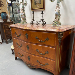 Appealing French Louis XIV style three drawer inlaid marble top commode. It has a stunning marble top and attractive ormolu trims. In good original detailed condition.