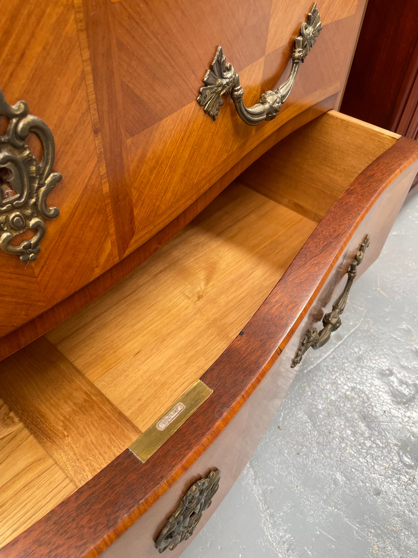 Appealing French Louis XIV style three drawer inlaid marble top commode. It has a stunning marble top and attractive ormolu trims. In good original detailed condition.