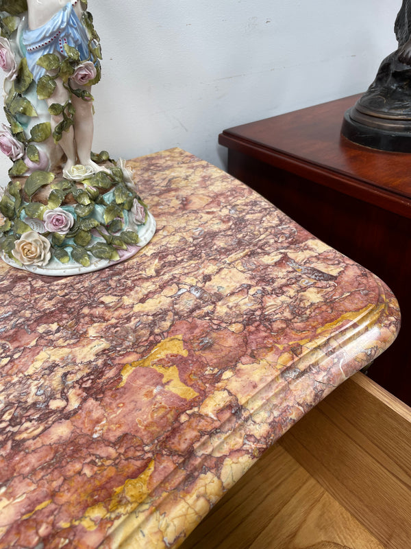 Appealing French Louis XIV style three drawer inlaid marble top commode. It has a stunning marble top and attractive ormolu trims. In good original detailed condition.