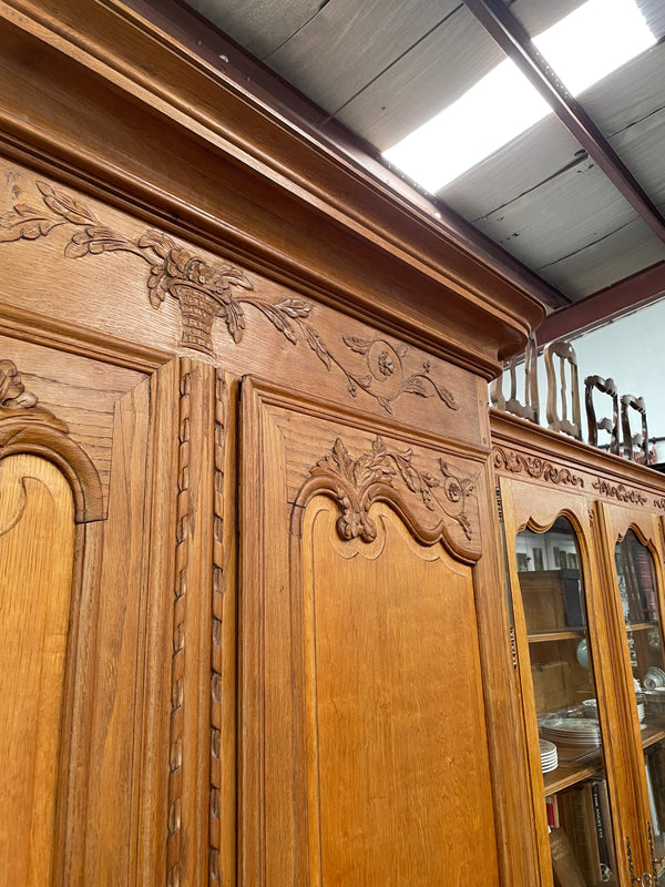 This attractive two door armoire has full hanging space. It is a pleasing piece with fine decorative carvings on the doors and is known as a marriage armoire. Imported directly from France and is in good original detailed condition.