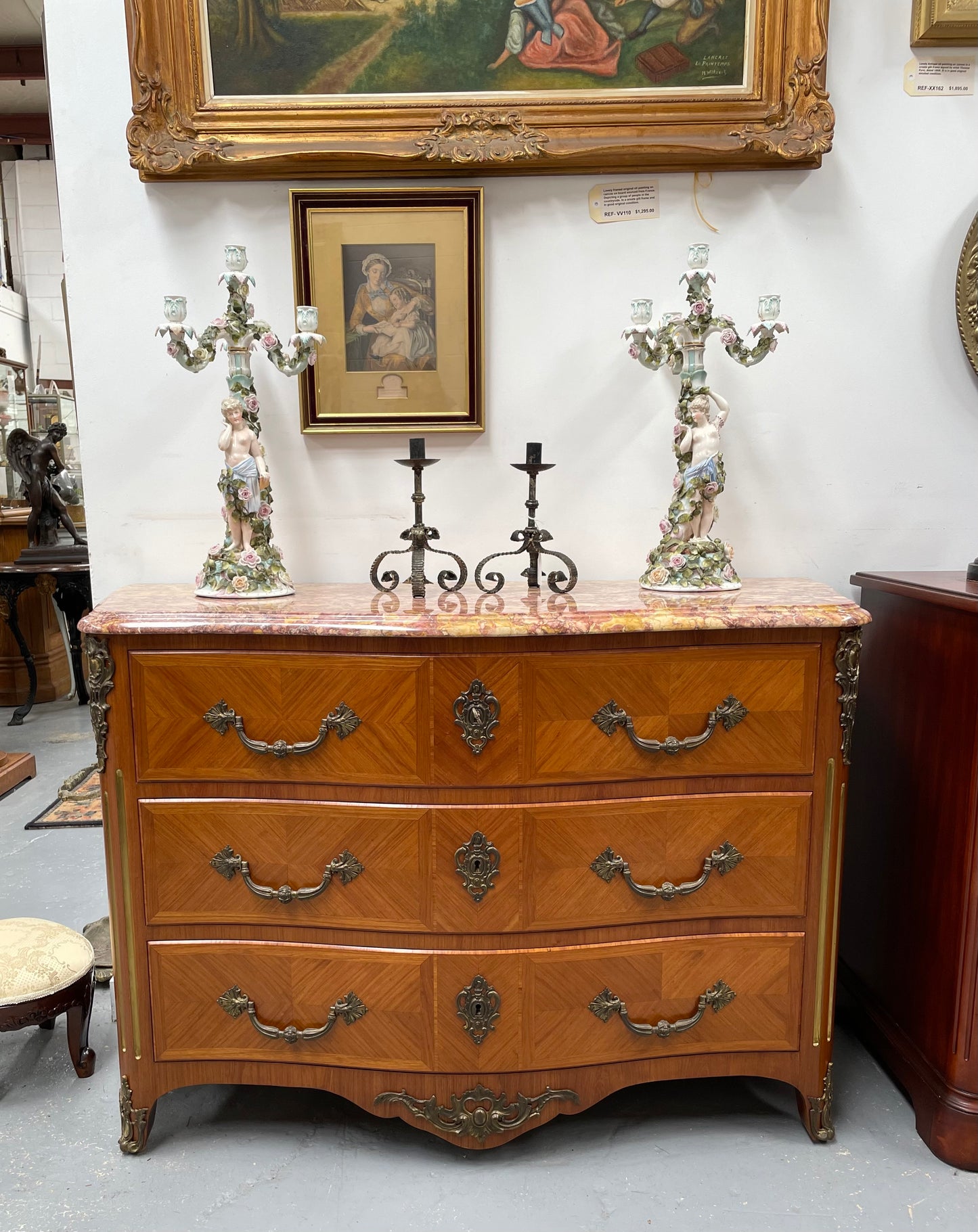 Appealing French Louis XIV style three drawer inlaid marble top commode. It has a stunning marble top and attractive ormolu trims. In good original detailed condition.