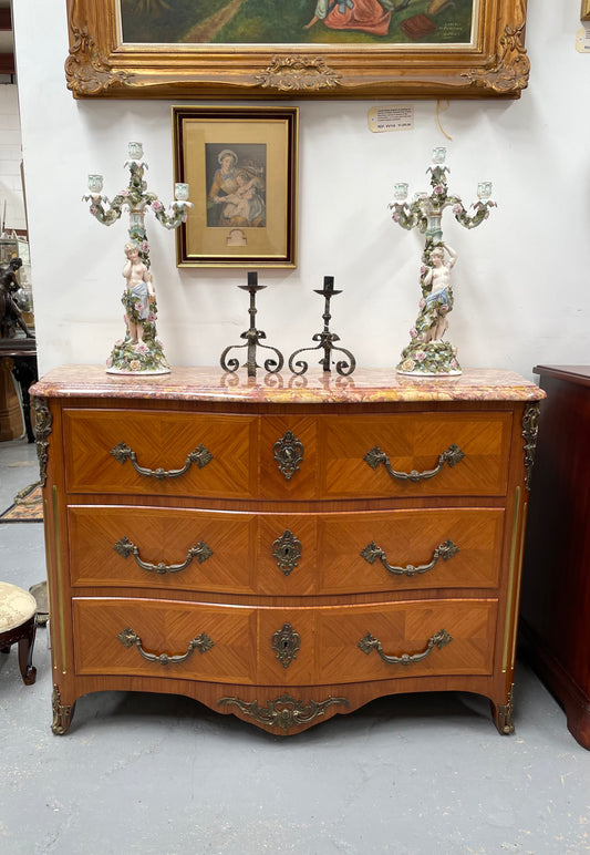 Appealing French Louis XIV style three drawer inlaid marble top commode. It has a stunning marble top and attractive ormolu trims. In good original detailed condition.