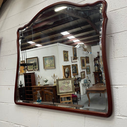 Large Mahogany framed bevelled edge wall mirror. In good original condition.