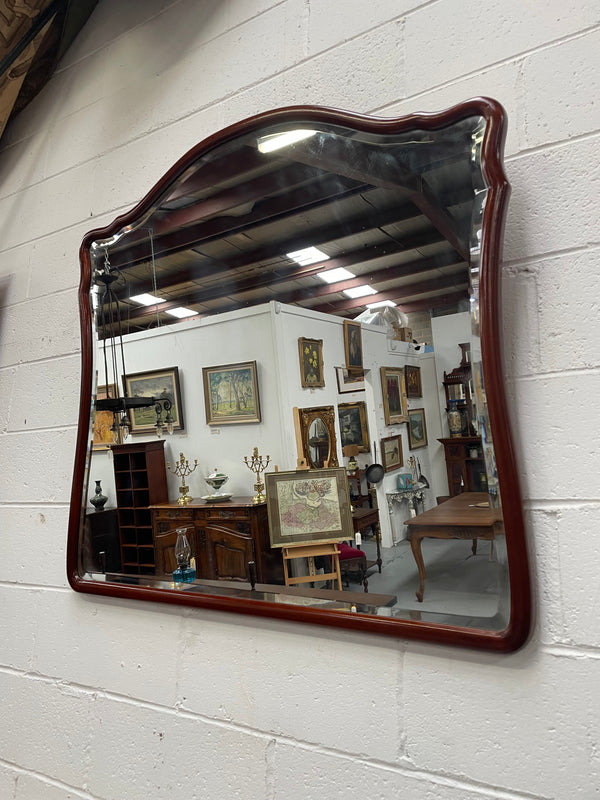 Large Mahogany framed bevelled edge wall mirror. In good original condition.