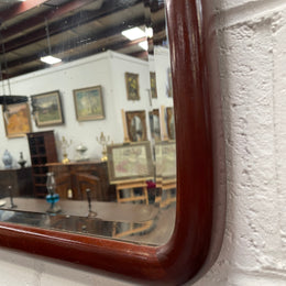 Large Mahogany framed bevelled edge wall mirror. In good original condition.