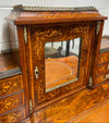 A very attractive burr walnut writing desk (Bonheur De Jour) with ormolu mounts throughout. The boxwood inlaid decoration is featured on the drawers and the mirrored cupboard which also feature brass galleries. The table area features burr walnut and a tooled leather inlay. A long drawer underneath features further inlay and stringing and all have lovely ormolu handles. It is a stunning piece of furniture of fantastic quality and makes a good ladies writing desk. In very good condition.