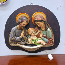 Vintage illuminated Holy Family wall plaque showing Mary, Joseph and the infant Jesus