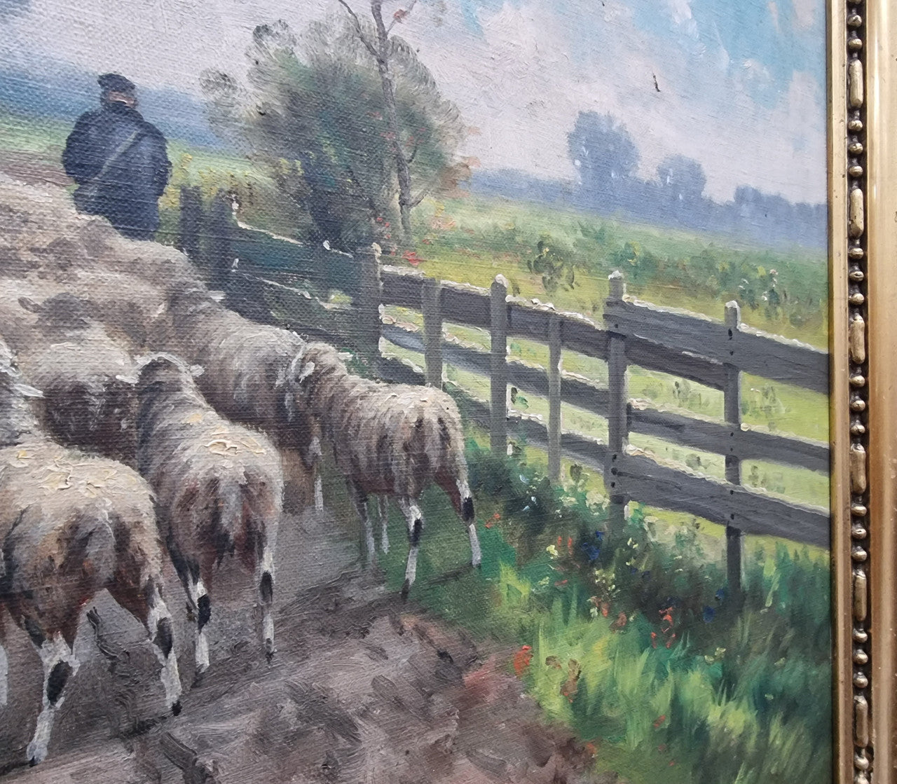 Sourced in France is this beautiful  oil painting on canvas of sheep on  a country farm and framed in a ornate gilt frame. In good original condition.