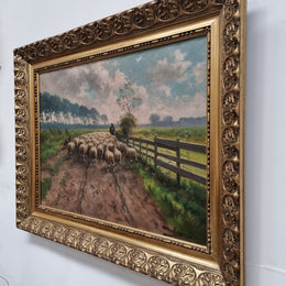Sourced in France is this beautiful  oil painting on canvas of sheep on  a country farm and framed in a ornate gilt frame. In good original condition.